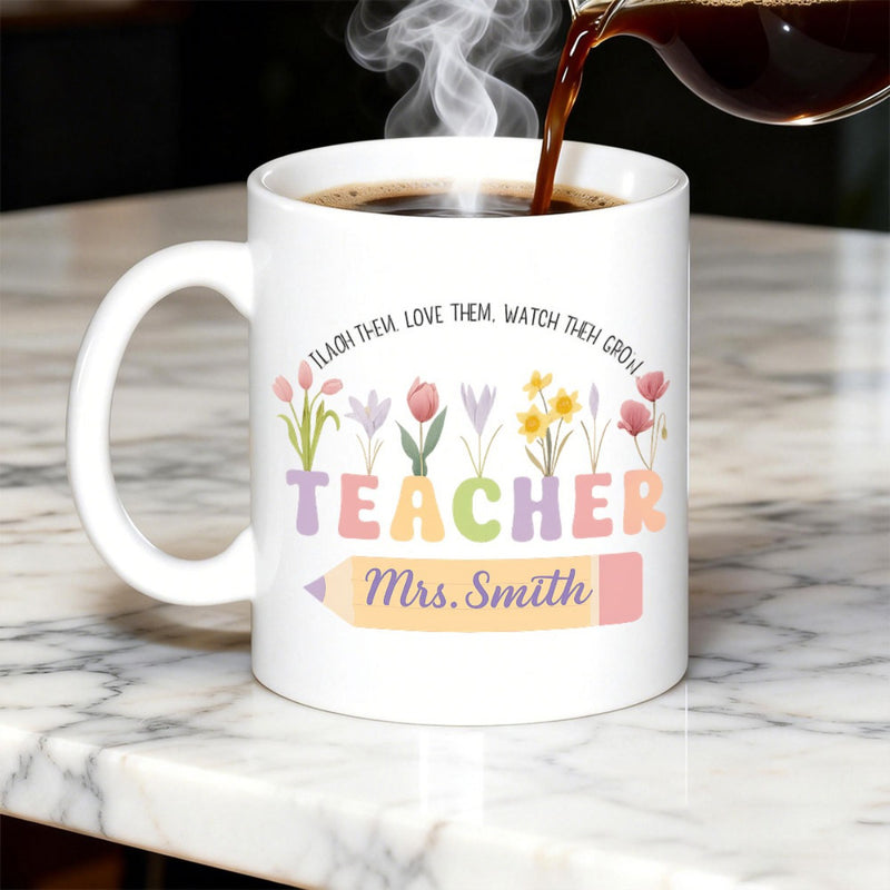 Tailorly White Ceramic 11 oz Mug - Teach Them Love Them Watch Them Grow Teacher Mrs Smith Vibrant Spring Flowers Blooming From Colorful Letters Above A Yellow