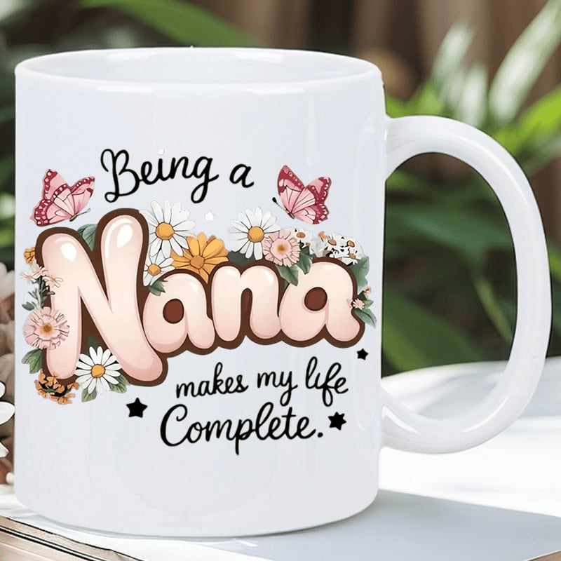 Tailorly White Ceramic 11 oz Mug - Being A Nana Makes My Life Complete Graceful Pink Butterflies Fluttering Among Blooming White Daisies And Lush Greenery