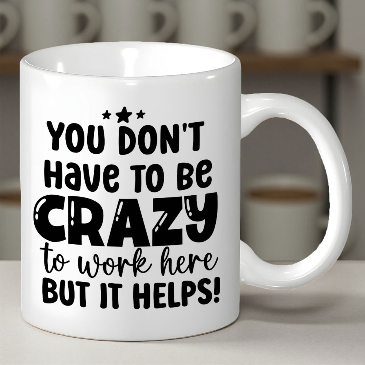 Tailorly White Ceramic 11 oz Mug - You Don't Have To Be Crazy To Work Here But It Helps Clean With Bold Black Typography And Decorative Stars Mug