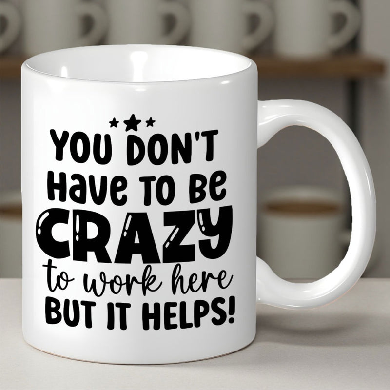 Tailorly White Ceramic 11 oz Mug - You Don't Have To Be Crazy To Work Here But It Helps Clean With Bold Black Typography And Decorative Stars Mug
