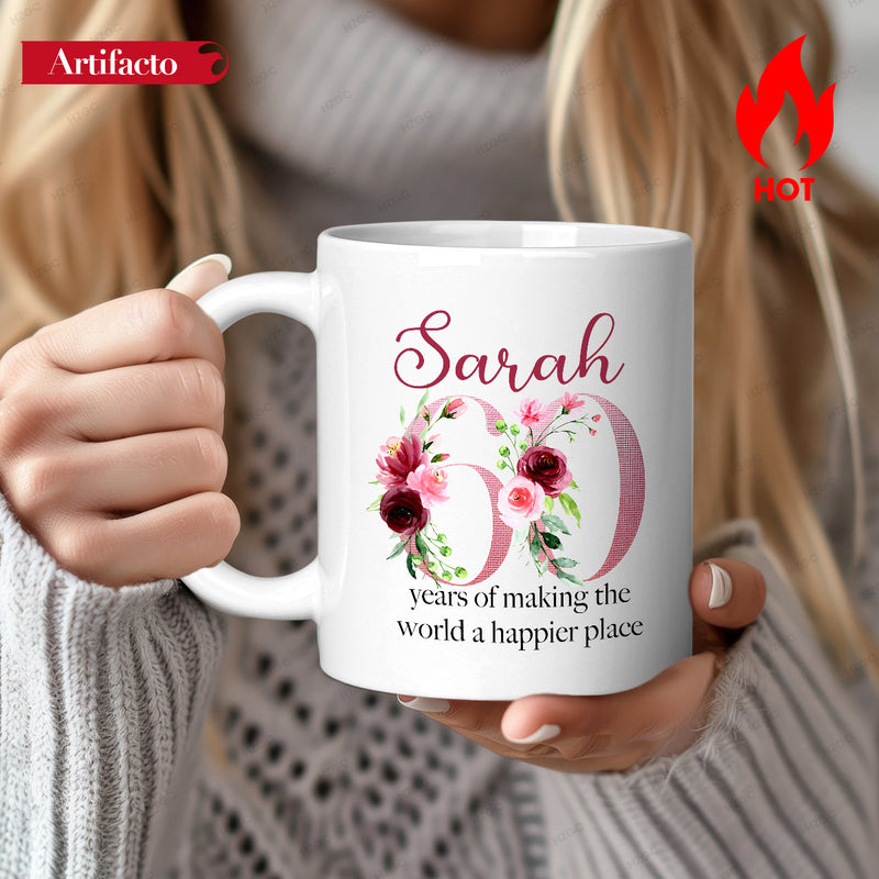 Tailorly White Ceramic 11 oz Mug - Sarah 60 Years Of Making The World A Happier Place Floral Blossoms With Elegant Green Leaves Adorning A Large Artistic Number
