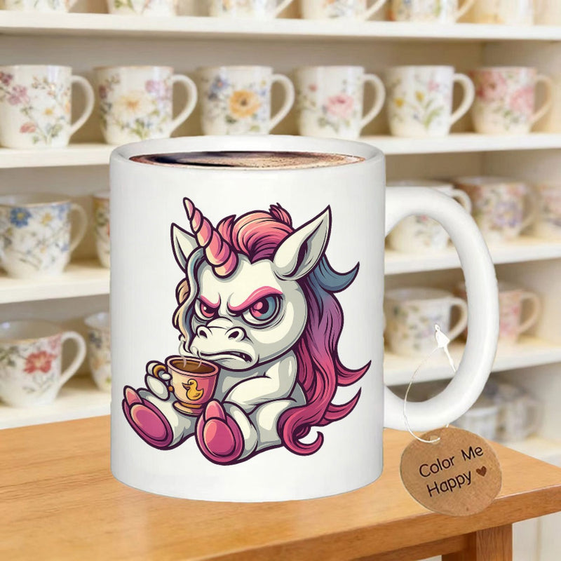 Tailorly White Ceramic 11 oz Mug - Color Me Happy Grumpy Cartoon Creature With Pink Mane Holding Small Cup Sitting Firmly Unicorn