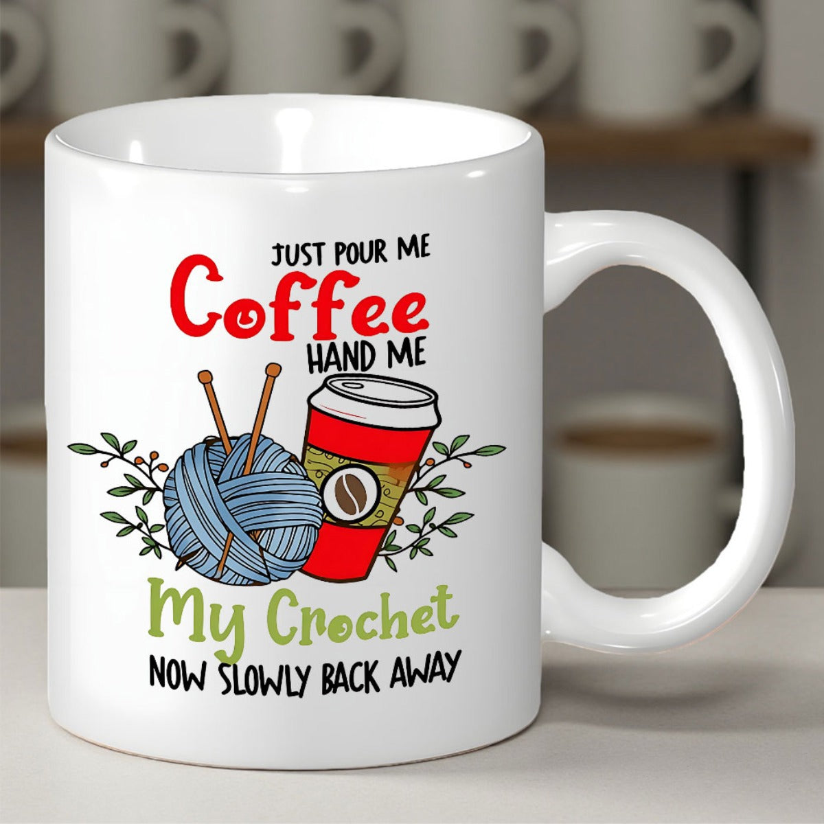Tailorly White Ceramic 11 oz Mug - Just Pour Me Coffee Hand Me My Crochet Now Slowly Back Away Handcrafted Blue Ball Of Yarn With Needles Beside A Coffee Cup Mug