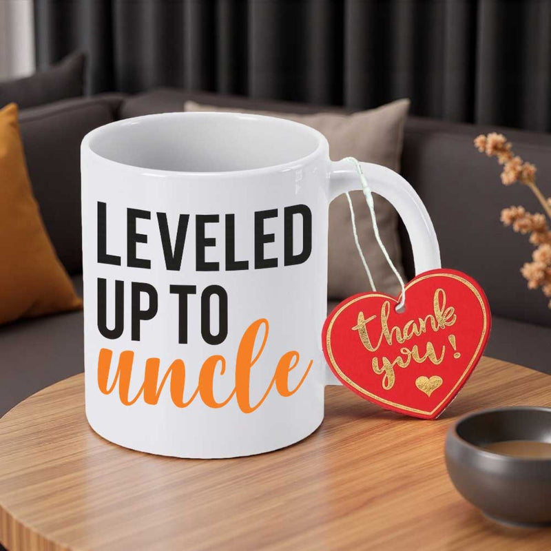 Tailorly White Ceramic 11 oz Mug - Leveled Up To Uncle Thank You Simple Ceramic Vessel With Bold Black Letters And Cursive Orange Typography Mug