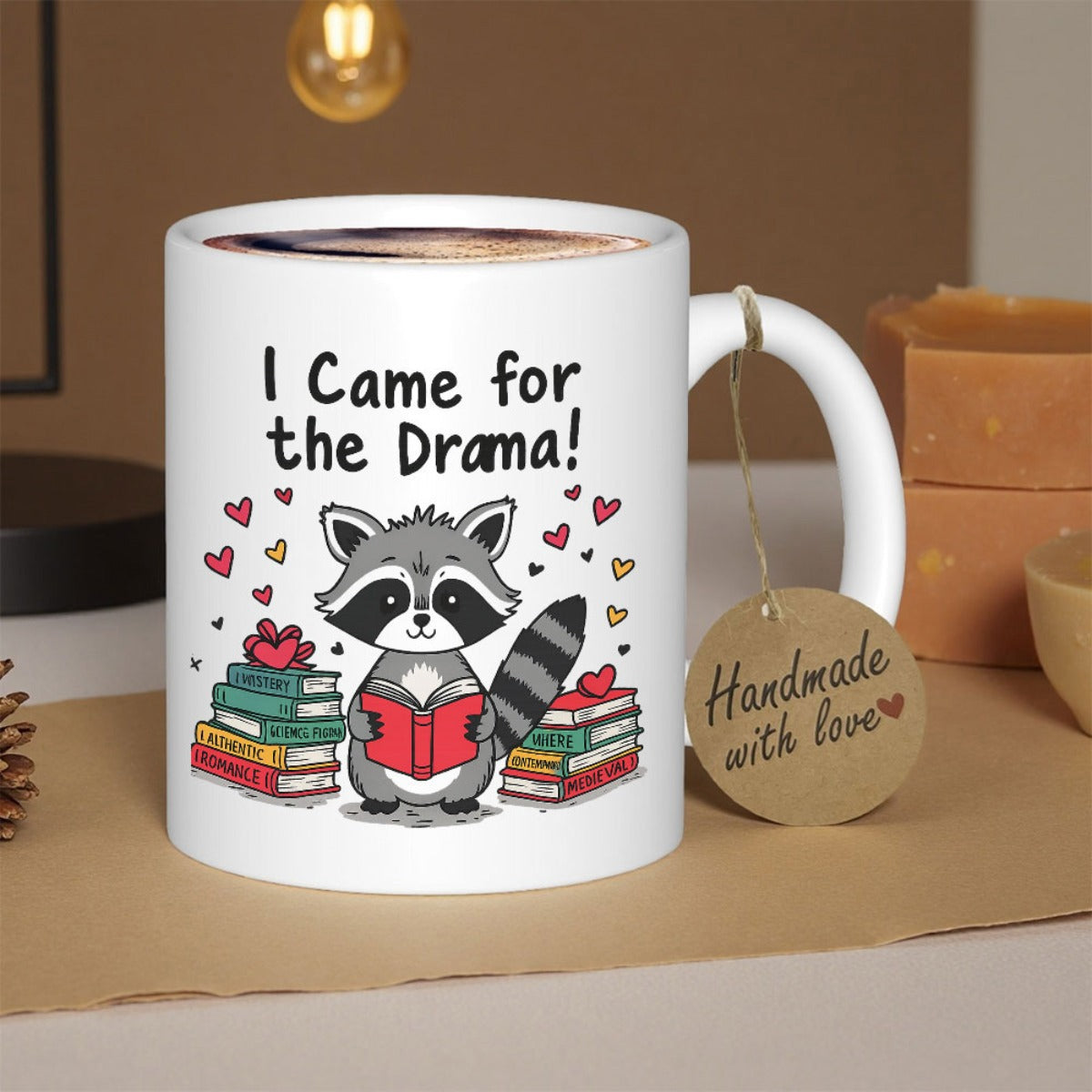 Tailorly White Ceramic 11 oz Mug - I Came For The Drama Studious Cartoon Character Reading Red Book Between Two Stacks Of Brightly Colored Novels Raccoon