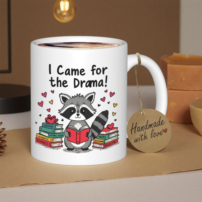 Tailorly White Ceramic 11 oz Mug - I Came For The Drama Studious Cartoon Character Reading Red Book Between Two Stacks Of Brightly Colored Novels Raccoon