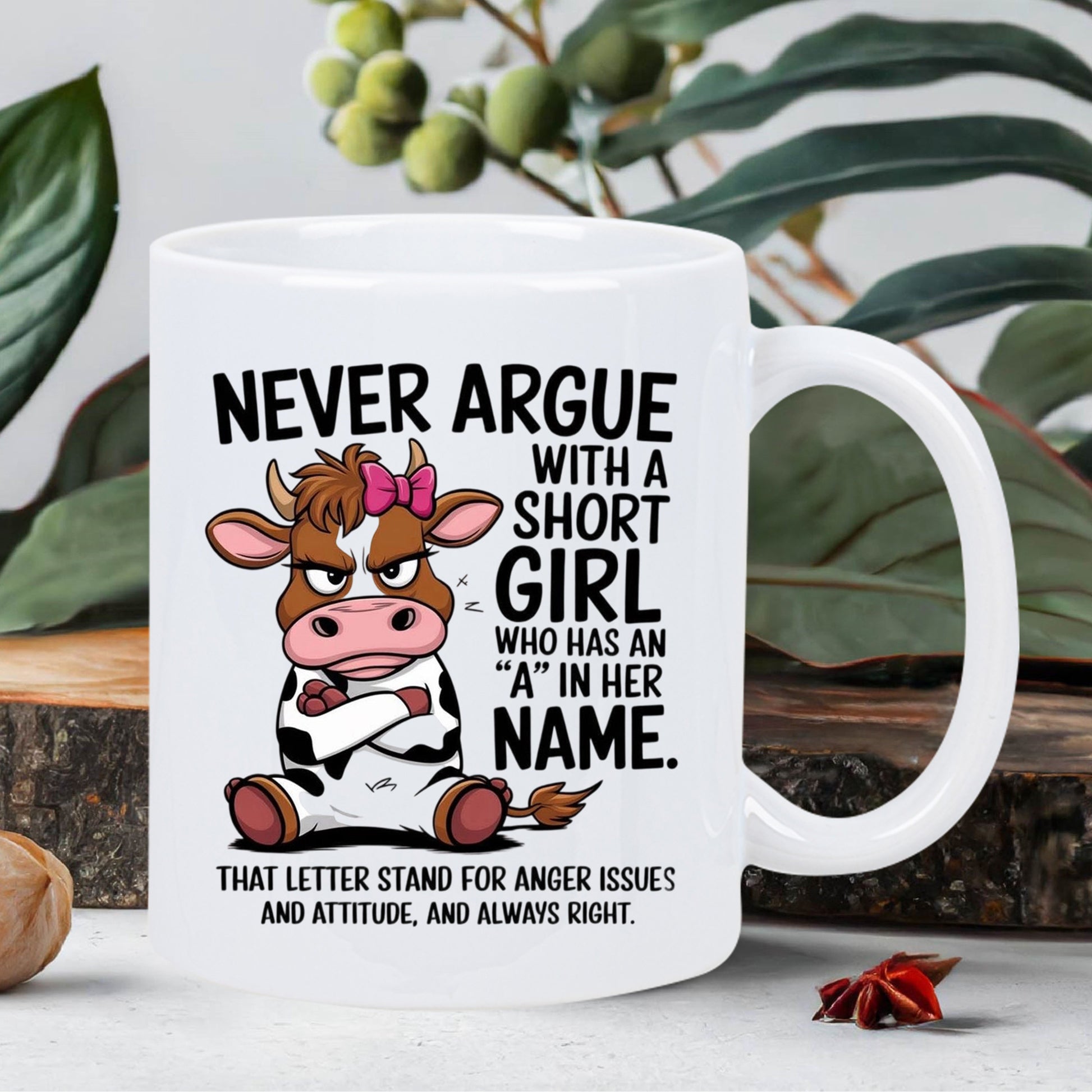 Tailorly White Ceramic 11 oz Mug - Never Argue With A Short Girl Who Has An A In Her Name Grumpy Cartoon Cow With Pink Bow Sitting Among Green Leaves Cow
