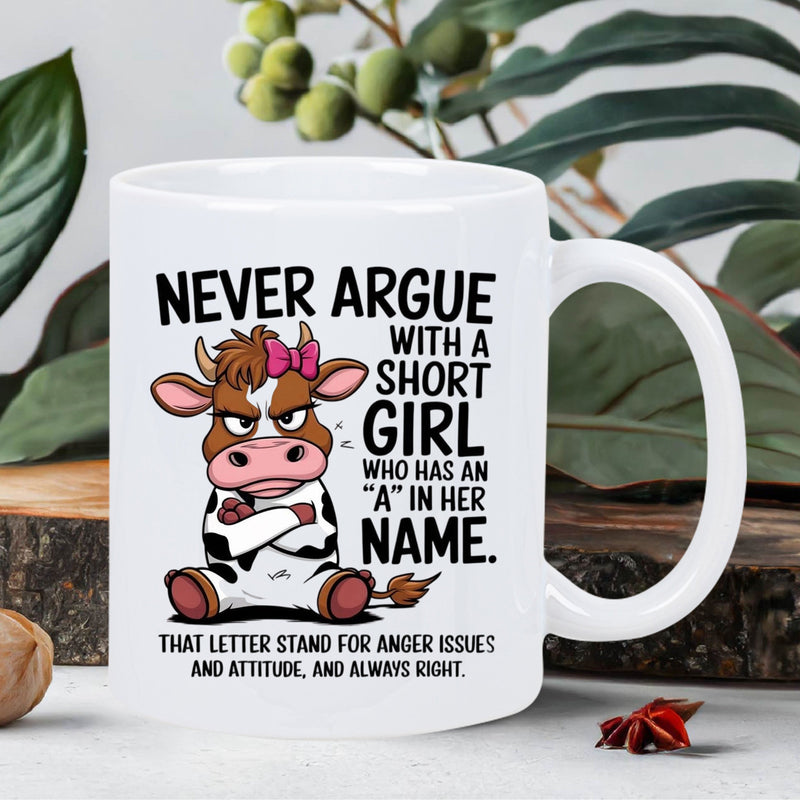 Tailorly White Ceramic 11 oz Mug - Never Argue With A Short Girl Who Has An A In Her Name Grumpy Cartoon Cow With Pink Bow Sitting Among Green Leaves Cow