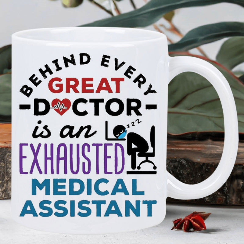 Tailorly White Ceramic 11 oz Mug - Behind Every Great Doctor Is An Exhausted Medical Assistant Tired Professional Figure Resting On Office Desk With Heart Symbol