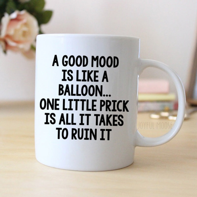 Tailorly White Ceramic 11 oz Mug - A Good Mood Is Like A Balloon One Little Prick Is All It Takes To Ruin It Bold Black Typography Printed On Simple White Surface