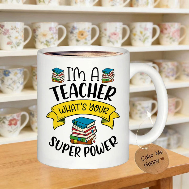 Tailorly White Ceramic 11 oz Mug - Im A Teacher Whats Your Super Power Colorful Stacks Of Academic Books Behind A Vibrant Yellow Banner Mug