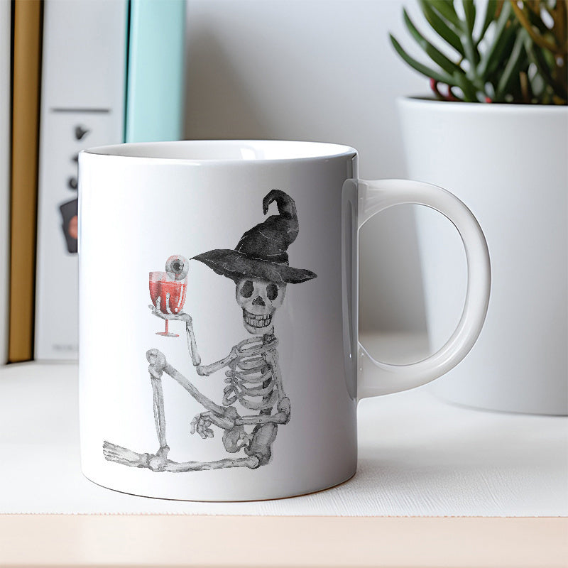 Tailorly White Ceramic 11 oz Mug - Hand Drawn Spooky Halloween Figure Wearing Witch Hat Holding Cocktail Sitting Skeleton