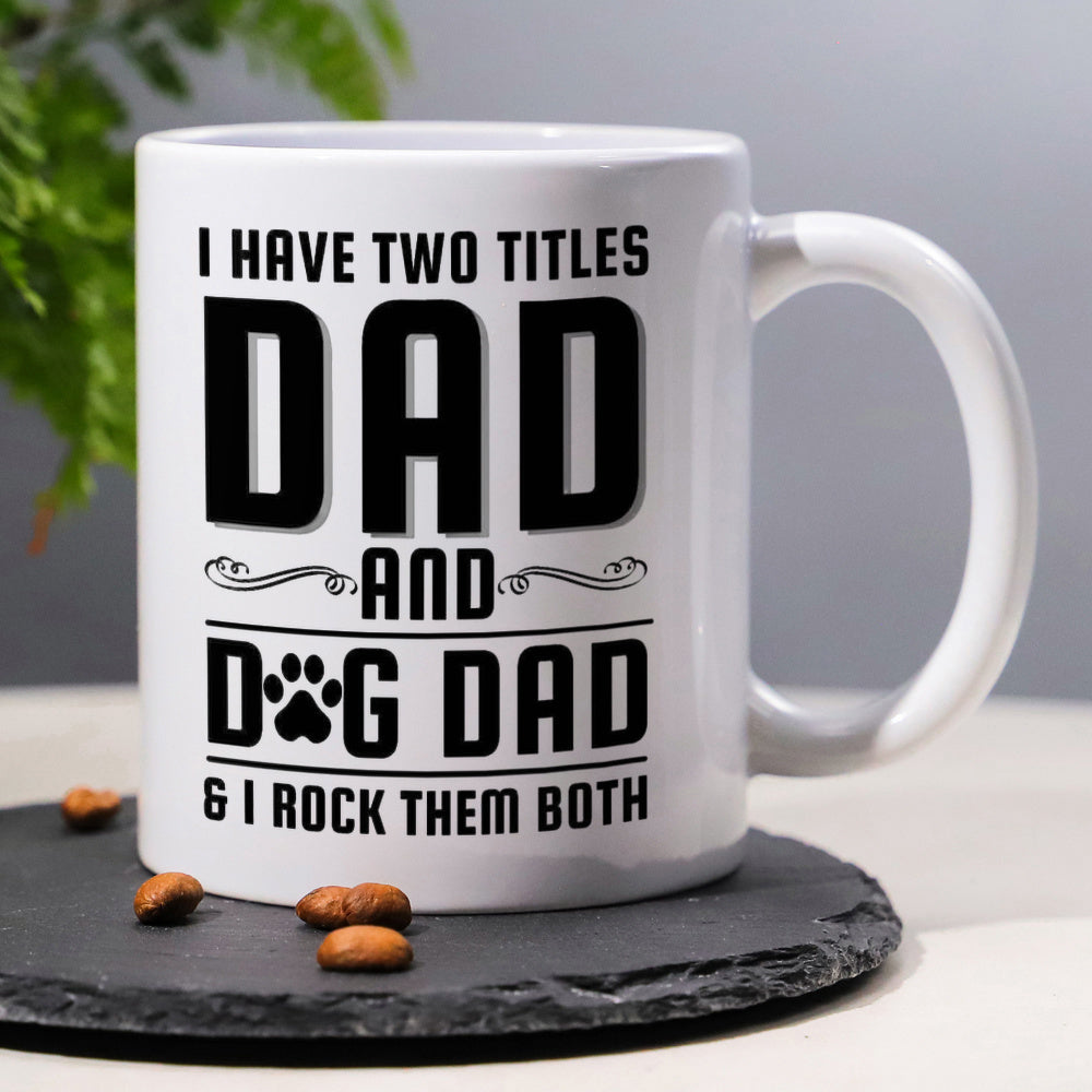 Tailorly White Ceramic 11 oz Mug - I Have Two Titles Dad And Dog Dad I Rock Them Both Bold Black Typography With Small Paw Print And Decorative Line Flourishes Mug