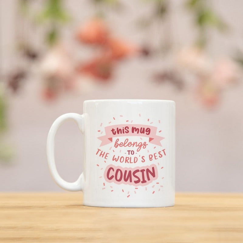 Tailorly White Ceramic 11 oz Mug - This Mug Belongs To The World's Best Cousin Pink Banners And Festive Confetti Surrounding Heartwarming Message For Family Member