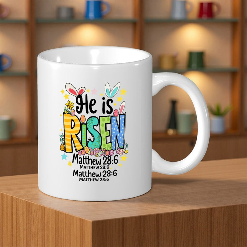 Tailorly White Ceramic 11 oz Mug - He Is Risen Matthew 28 6 Colorful Artistic Text With Cute Bunny Ears And Tiny Spring Flowers Mug