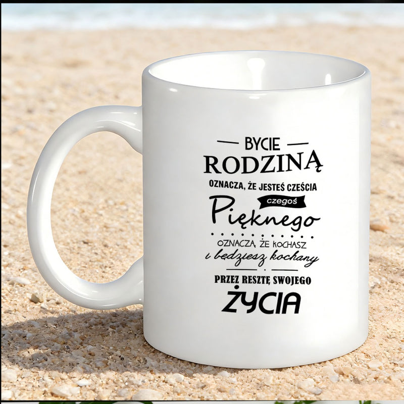 Tailorly White Ceramic 11 oz Mug - Pure With Elegant Black Typography Resting On Sand Mug