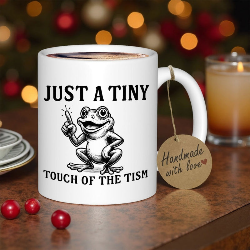 Tailorly White Ceramic 11 oz Mug - Just A Tiny Touch Of The Tism Happy Sitting Cartoon Frog Pointing Upward On Clean White Background Frog