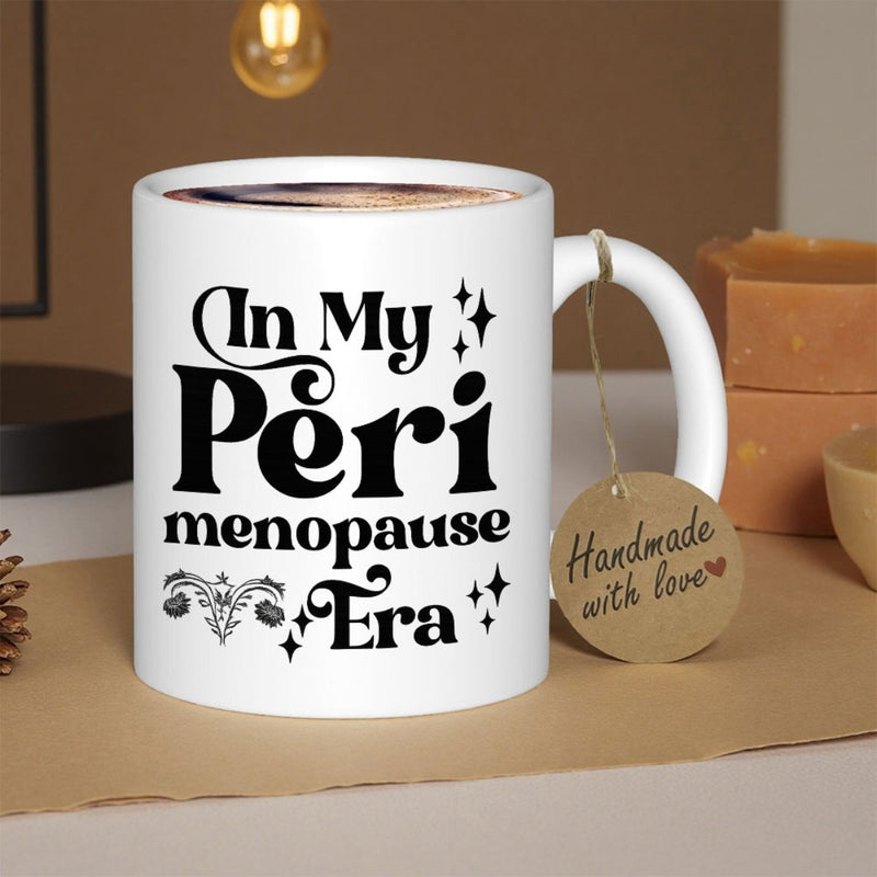 Tailorly White Ceramic 11 oz Mug - In My Peri Menopause Era Vintage Retro Typography Featuring Sparkling Stars And Female Anatomy Symbol Mug