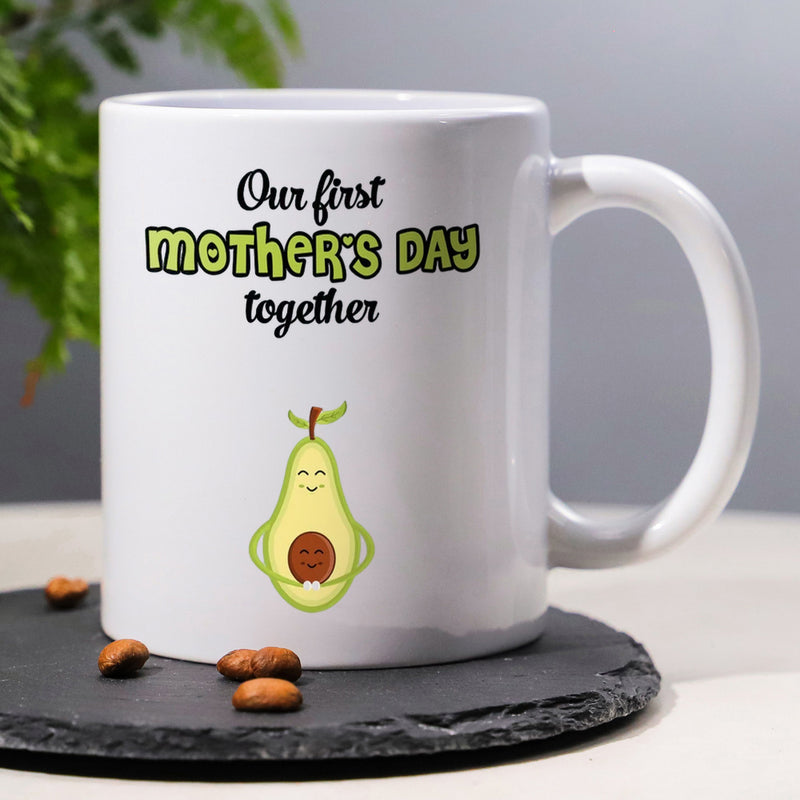 Tailorly White Ceramic 11 oz Mug - Our First Mothers Day Together Smiling Green Fruit Character Holding Small Brown Seed Baby Avocado