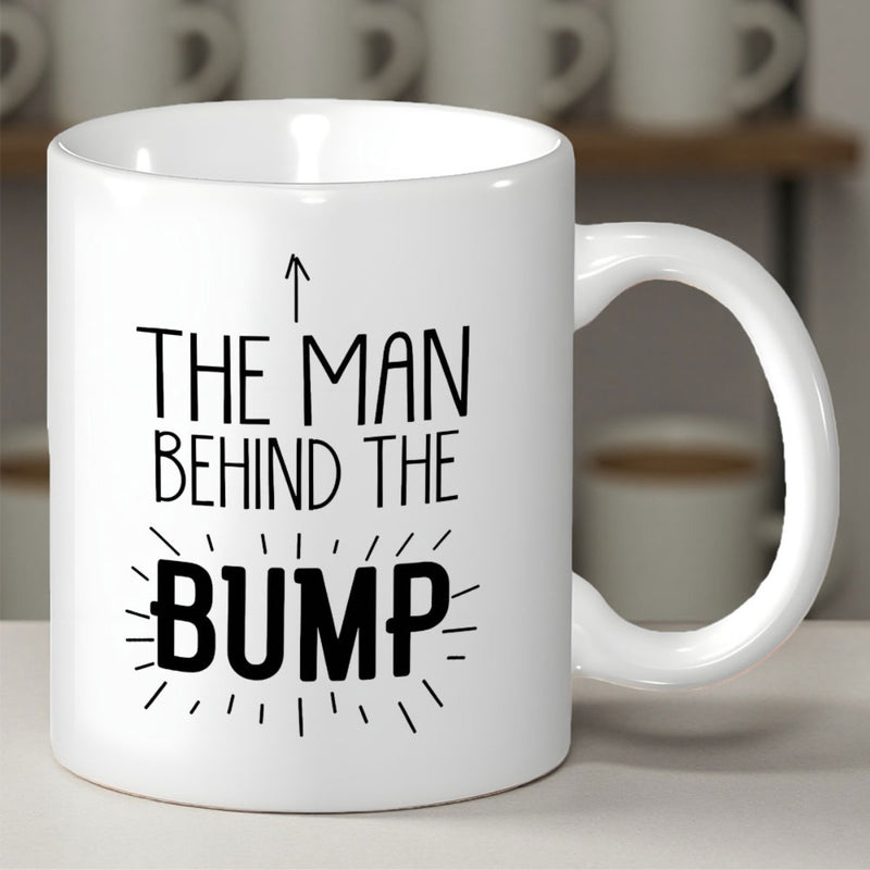 Tailorly White Ceramic 11 oz Mug - The Man Behind The Bump Minimalist Black Lettering With Upward Arrow And Radiating Lines Accents Mug