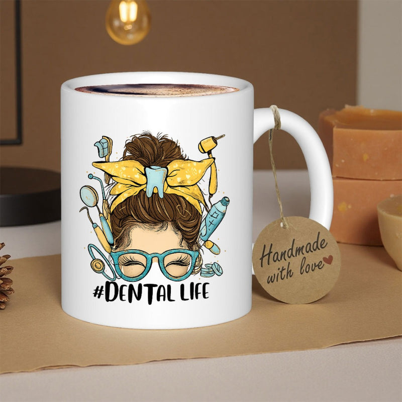 Tailorly White Ceramic 11 oz Mug - Dental Life Artistic Messy Bun Wearing Teal Glasses With Dental Tools Woman