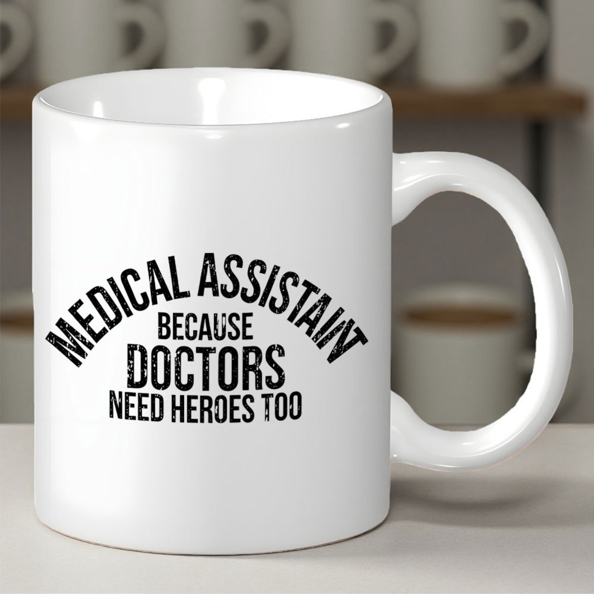 Tailorly White Ceramic 11 oz Mug - Medical Assistant Because Doctors Need Heroes Too Bold Distressed Black Vintage Lettering Arranged In Arched Layout Sign