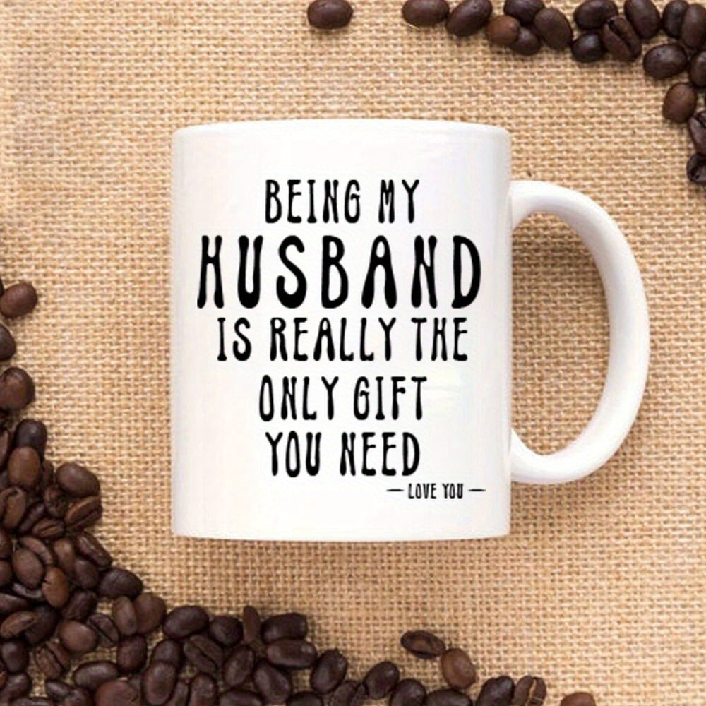 Tailorly White Ceramic 11 oz Mug - Being My Husband Is Really The Only Gift You Need Love You Minimalist White Ceramic Vessel Resting Amidst Roasted Dark Coffee