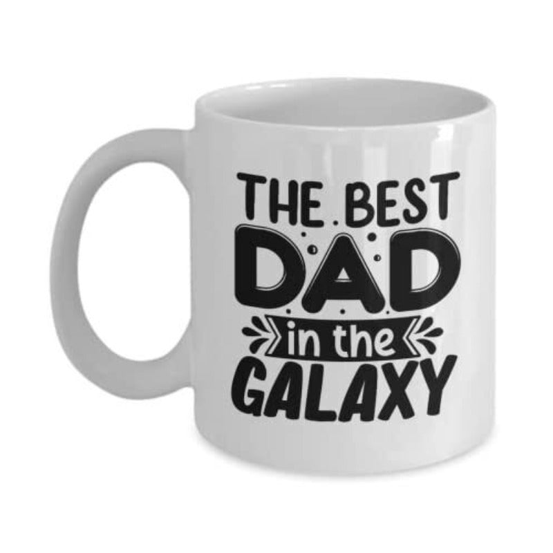 Tailorly White Ceramic 11 oz Mug - The Best Dad In The Galaxy Bold Rounded Typography With Decorative Banner And Small Sparkling Bubbles Galaxy