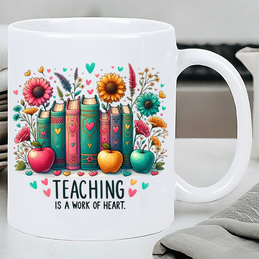 Tailorly White Ceramic 11 oz Mug - Teaching Is A Work Of Heart Vibrant Flowers Blooming Around A Stack Of Colorful Academic Books