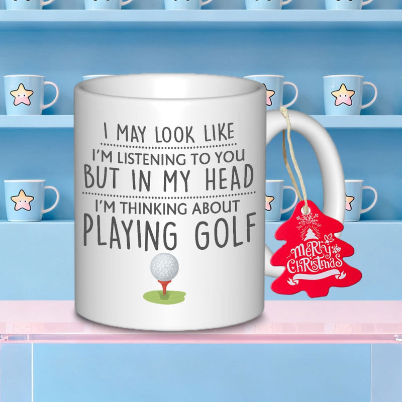 Tailorly White Ceramic 11 oz Mug - I May Look Like Im Listening To You But In My Head Im Thinking About Playing Golf Minimalist Dimpled Sphere Resting On A Red Tee