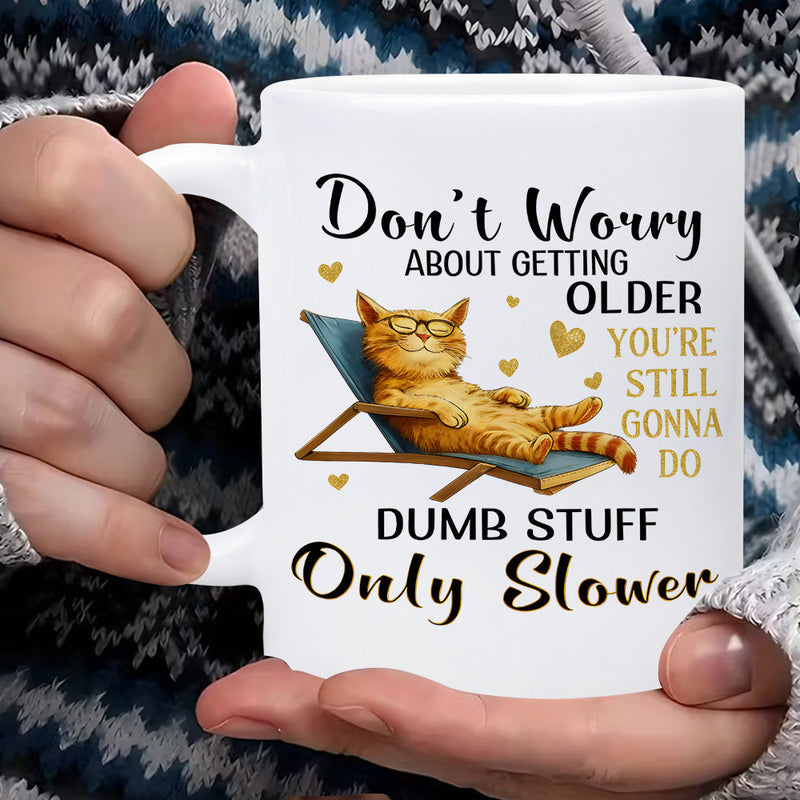 Tailorly White Ceramic 11 oz Mug - Dont Worry About Getting Older Youre Still Gonna Do Dumb Stuff Only Slower Relaxing Orange Tabby Wearing Glasses On Blue Lounge