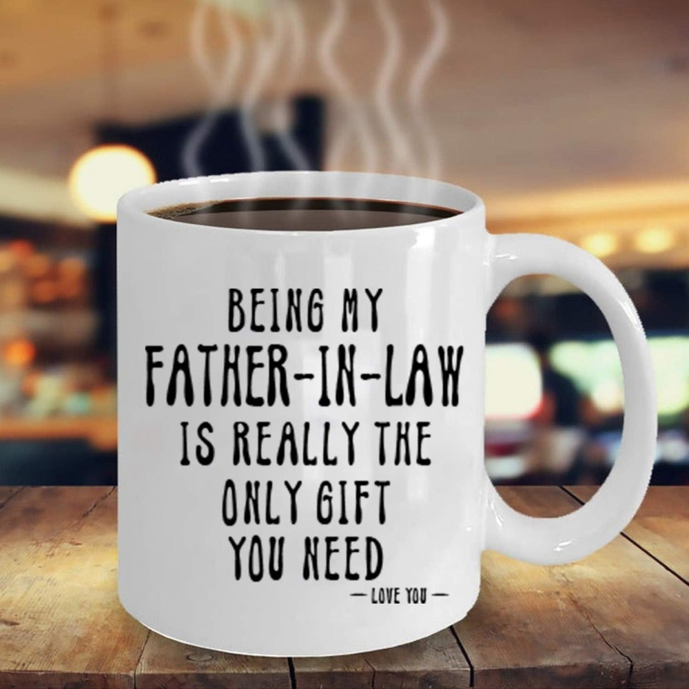 Tailorly White Ceramic 11 oz Mug - Being My Father In Law Is Really The Only Gift You Need Love You Minimalist White Ceramic Vessel Resting Upon A Weathered Wooden