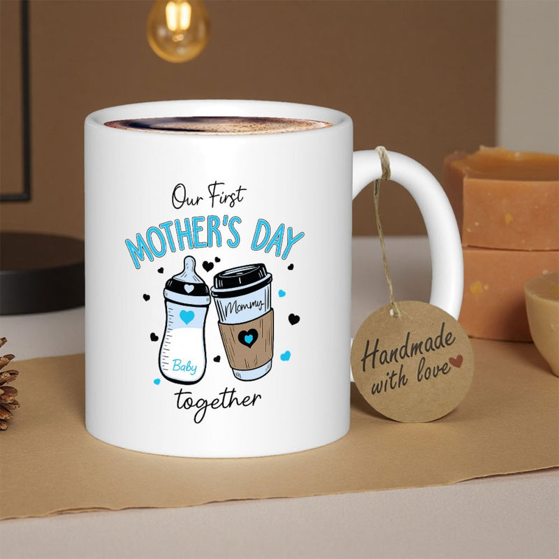 Tailorly White Ceramic 11 oz Mug - Our First Mother's Day Together Cartoon Baby Bottle And Coffee Cup Clinking Under Small Floating Hearts Cup