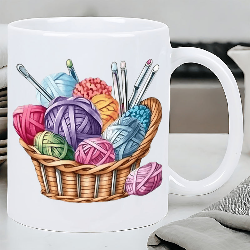 Tailorly White Ceramic 11 oz Mug - Colorful Soft Yarn Balls And Knitting Needles Inside Woven Wicker Basket