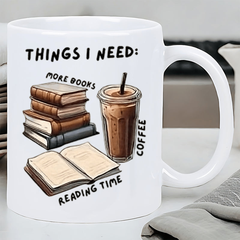 Tailorly White Ceramic 11 oz Mug - Things I Need More Books Coffee Reading Time Stack Of Aged Books Beside Chilled Iced Coffee Mug