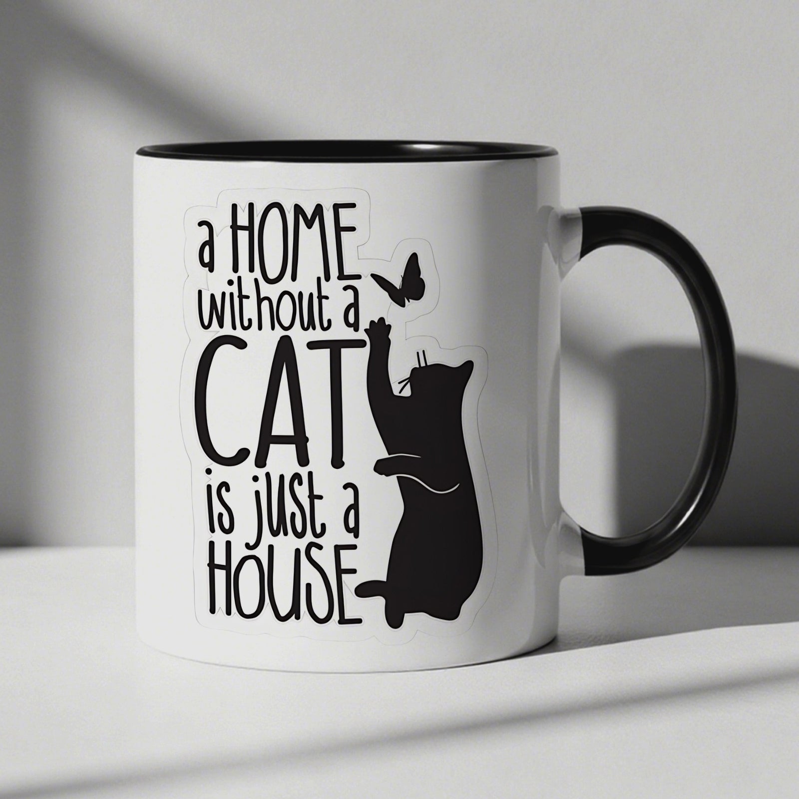Tailorly Black Accent 11 oz Mug - cute cat silhouette with text "a home without a cat is a house"