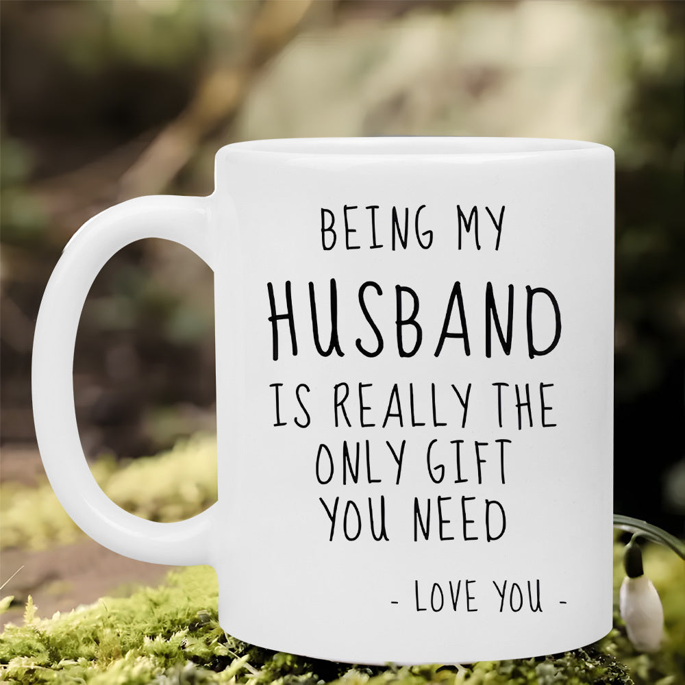 Tailorly White Ceramic 11 oz Mug - Being My Husband Is Really The Only Gift You Need Love You Minimalist White Ceramic Vessel Sitting On Lush Green Forest Moss Mug