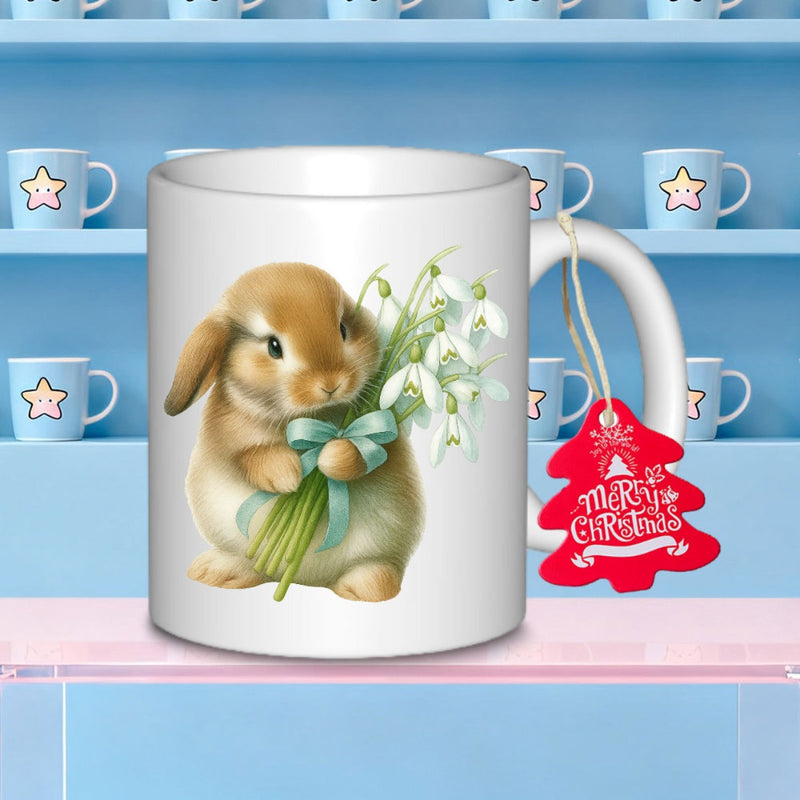 Tailorly White Ceramic 11 oz Mug - Merry Christmas Cute Fluffy Brown Holding White Snowdrop Flowers Tied With Green Ribbon Rabbit