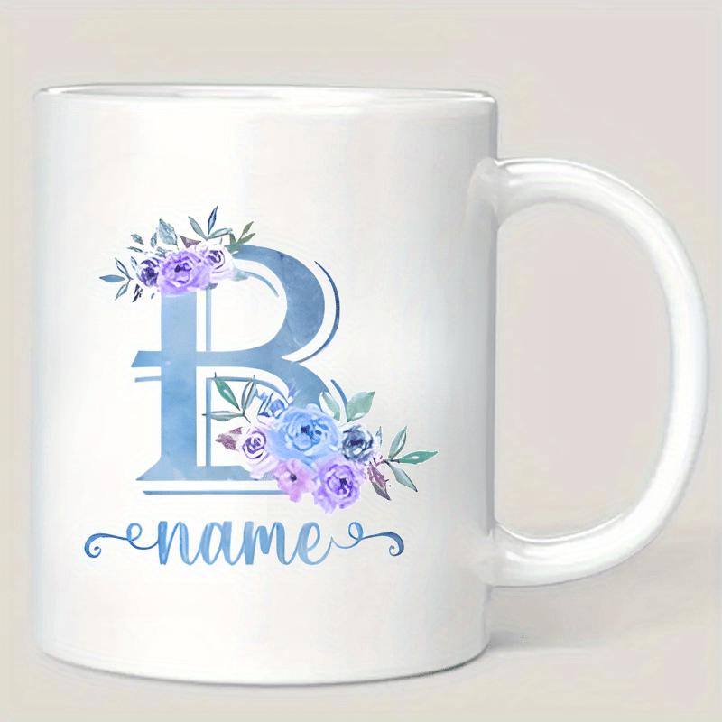 Tailorly White Ceramic 11 oz Mug - Name Elegant Watercolor Flowers Blooming Softly Beside A Serene Gradient Blue Letter