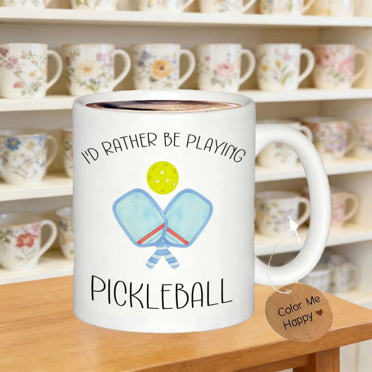 Tailorly White Ceramic 11 oz Mug - I'd Rather Be Playing Pickleball Two Light Blue Paddles Crossed Under A Bright Yellow Perforated Ball