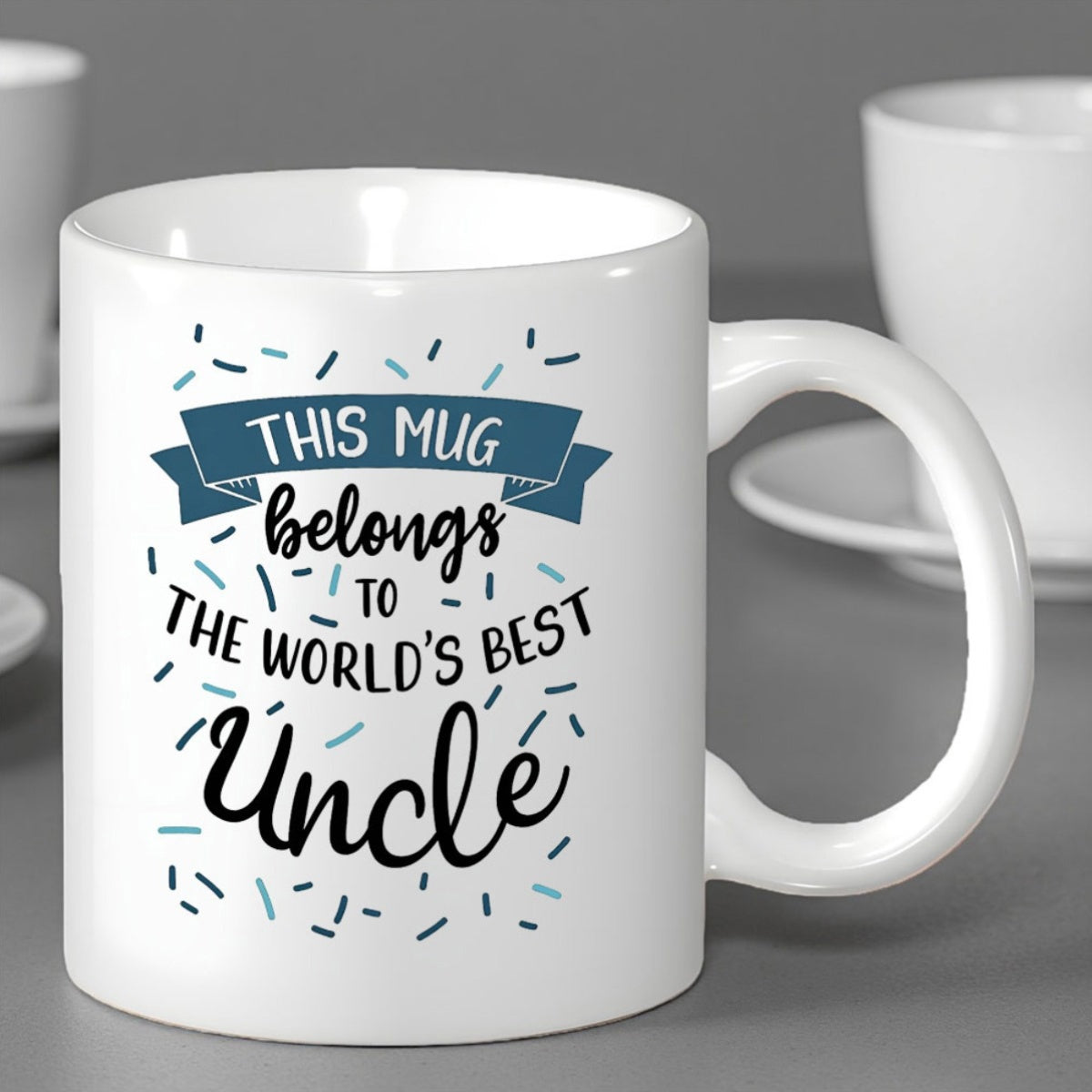 Tailorly White Ceramic 11 oz Mug - This Mug Belongs To The World's Best Uncle Elegant Ceramic Vessel With Festive Blue Banner And Floating Dash Sprinkles Mug