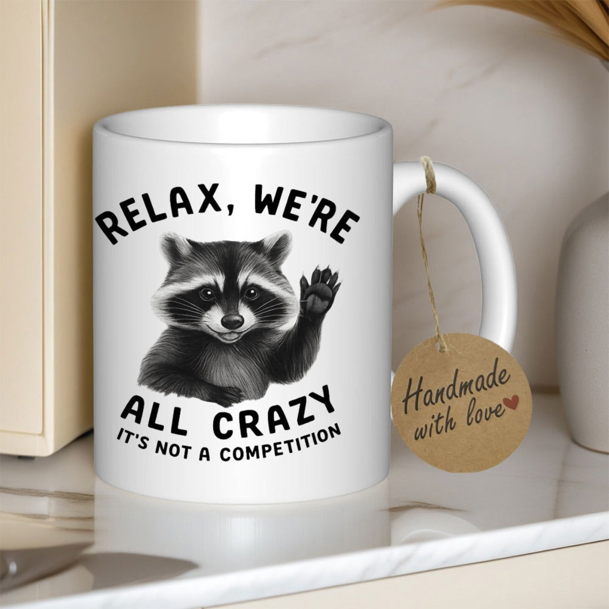 Tailorly White Ceramic 11 oz Mug - Relax Were All Crazy Its Not A Competition Adorable Grayscale Forest Raccoon Waving Its Small Paw Gently With Humor Raccoon