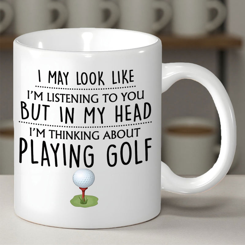 Tailorly White Ceramic 11 oz Mug - I May Look Like Im Listening To You But In My Head Im Thinking About Playing Golf Polished White Ball Resting On Red Tee Upon