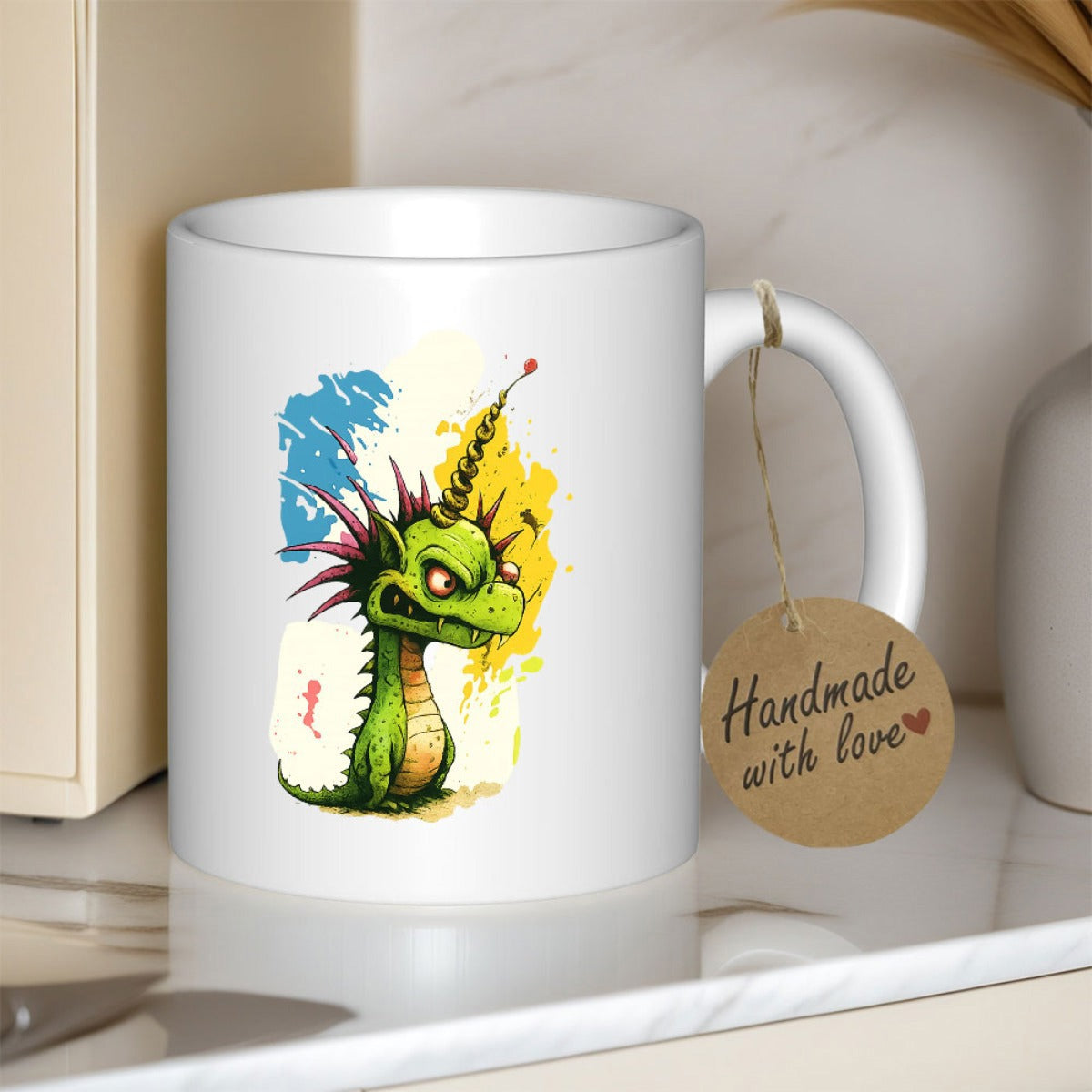 Tailorly White Ceramic 11 oz Mug - Little Grumpy Green Monster Standing Amidst Vibrant Abstract Watercolor Splashes Dragon