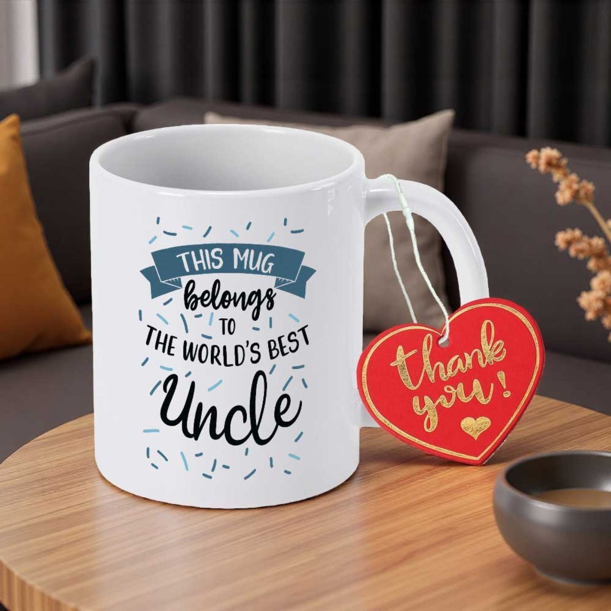 Tailorly White Ceramic 11 oz Mug - This Mug Belongs To The Worlds Best Uncle Ceramic Cylindrical Cup Featuring Decorative Confetti Patterns And A Blue Banner Mug