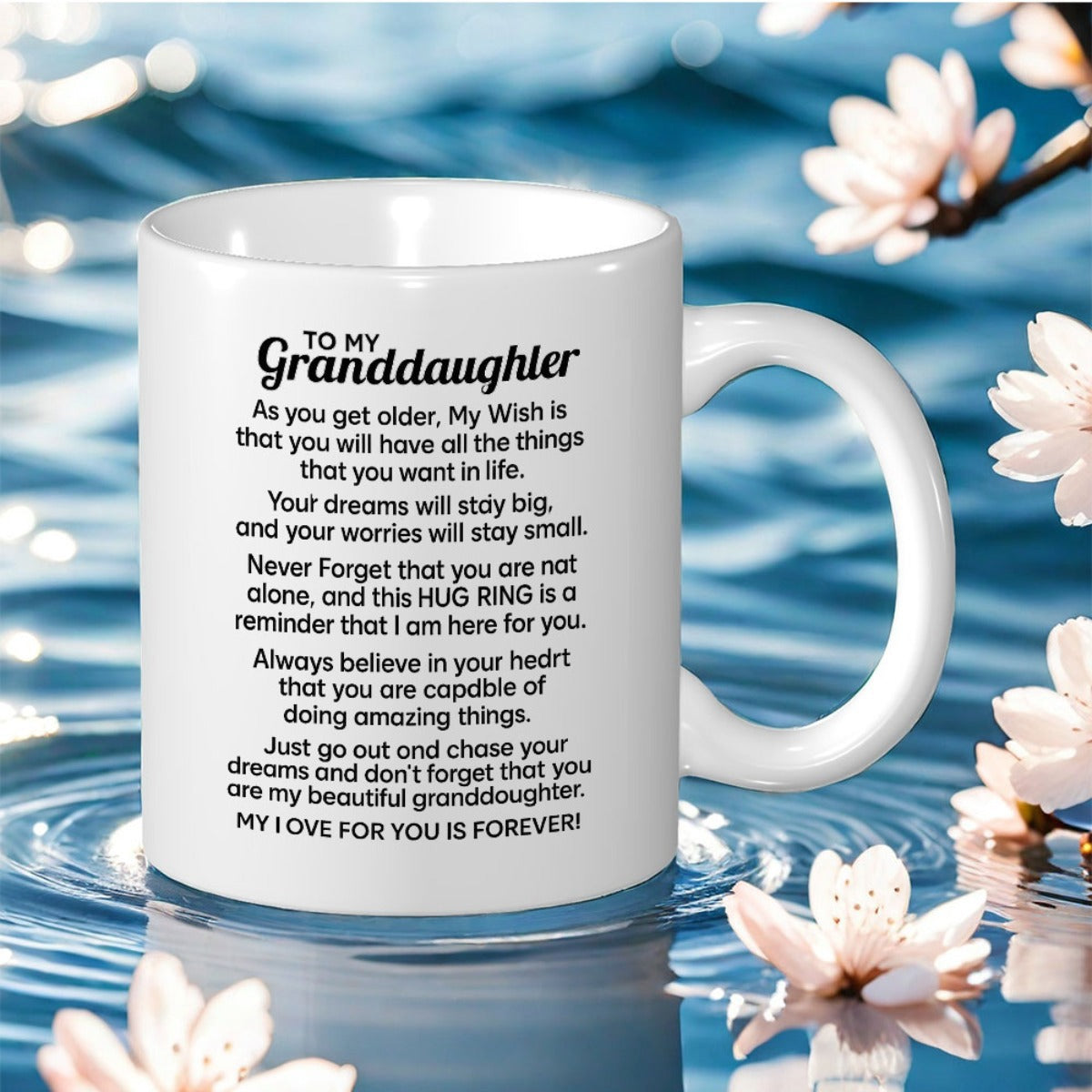 Tailorly White Ceramic 11 oz Mug - To My Granddaughter White Ceramic Cup Resting On Rippling Blue Water Among Blooming Cherry Blossoms Mug