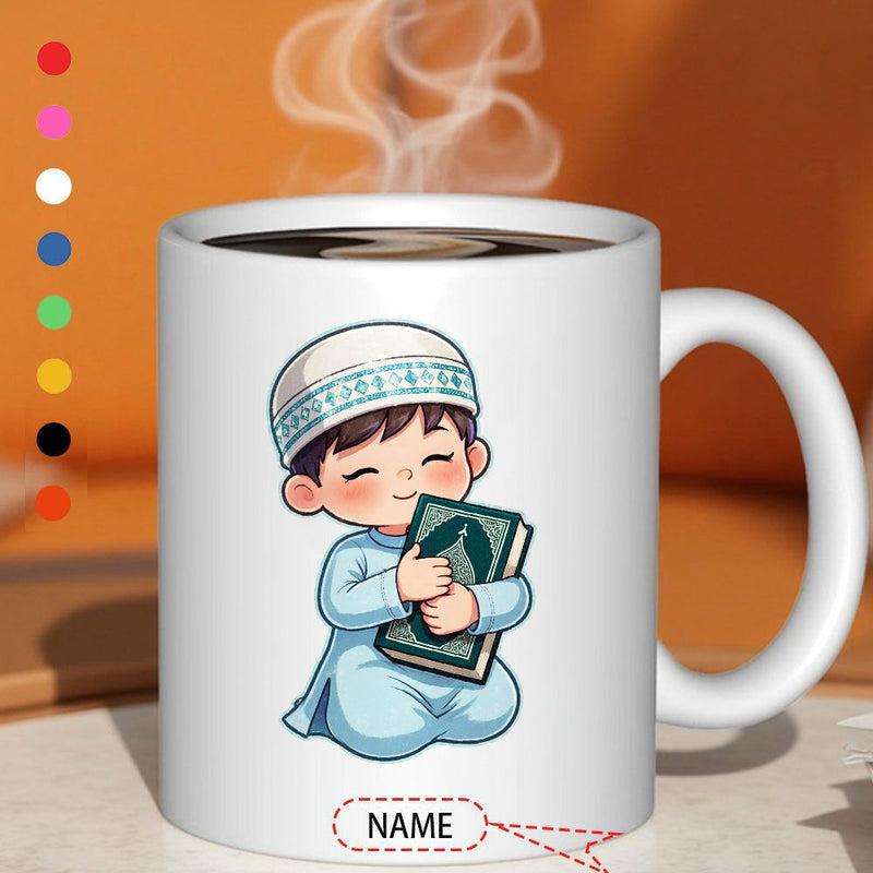 Tailorly White Ceramic 11 oz Mug - Name Small Muslim Child Wearing Traditional Robe Hugging Green Holy Book Boy