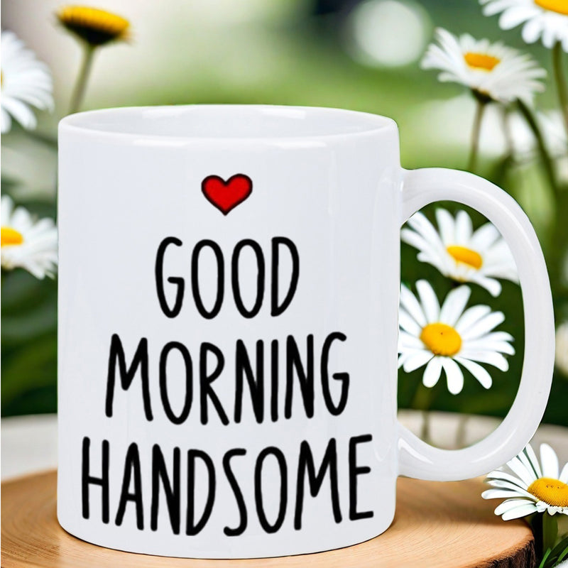 Tailorly White Ceramic 11 oz Mug - Good Morning Handsome Simple White Ceramic Cup Sitting On Wooden Coaster With Daisies Around Mug