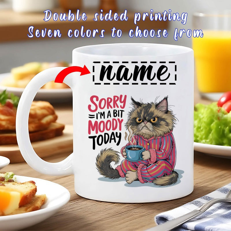 Tailorly White Ceramic 11 oz Mug - Sorry Im A Bit Moody Today Fluffy Grumpy Long Haired Feline Wearing Pink Striped Pajamas Holding Coffee Cat
