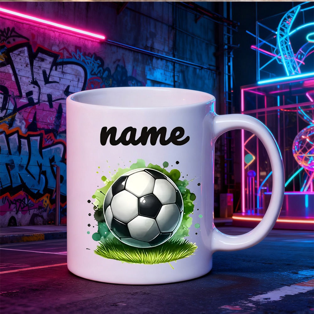 Tailorly White Ceramic 11 oz Mug - Name Classic Resting On Vibrant Green Grass Among Artistic Splashes Soccer Ball